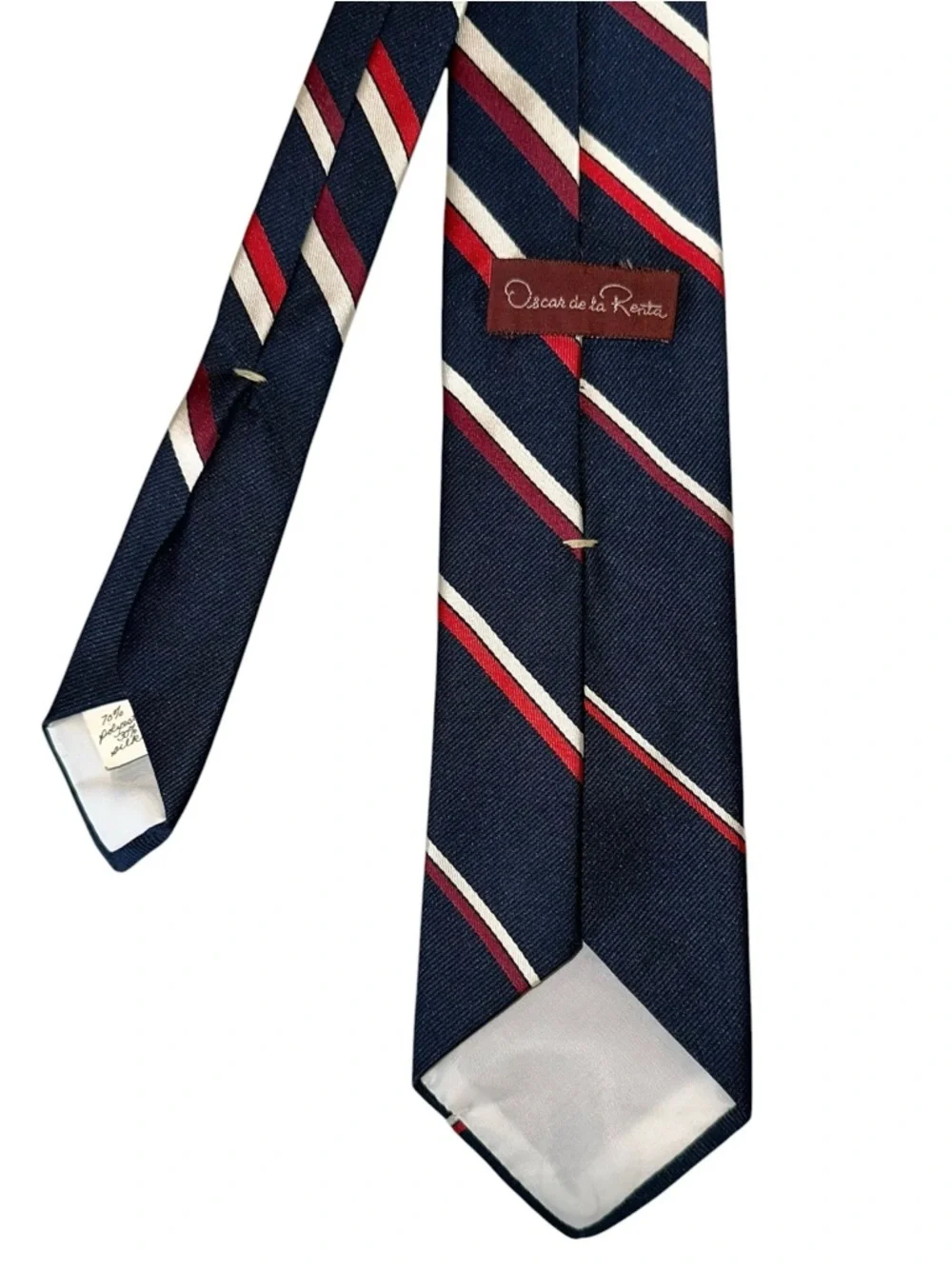 Oscar de la Renta tie gently